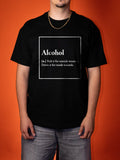 A man wearing a black graphic t-shirt with a white printed definition of the word 'Alcohol' on the chest, posed against a solid orange background.