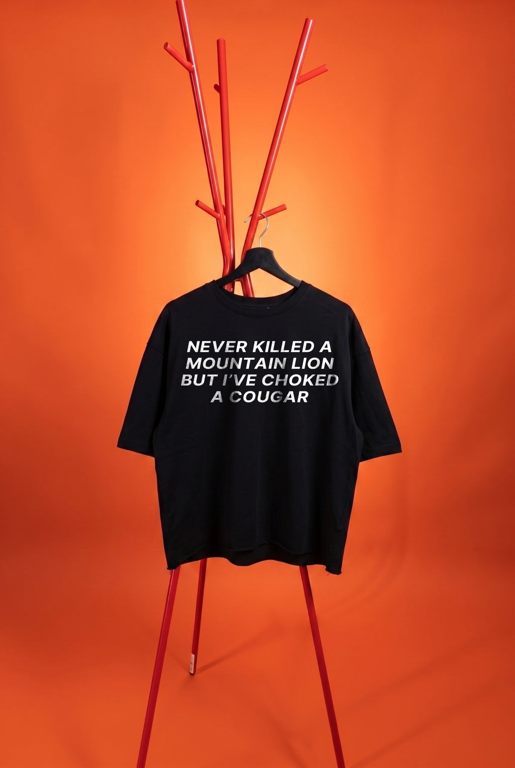 black t-shirt with dad joke on an orange background