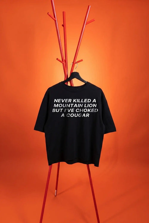 black t-shirt with dad joke on an orange background