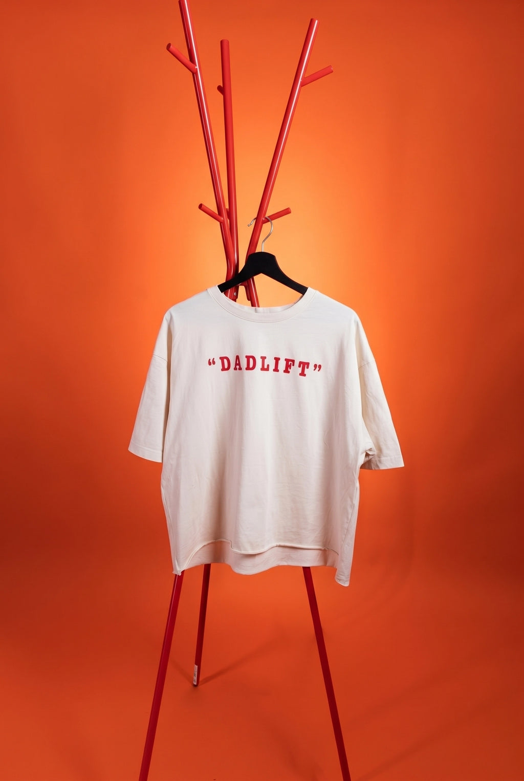 white t-shirt with "dadlift" text on an orange background